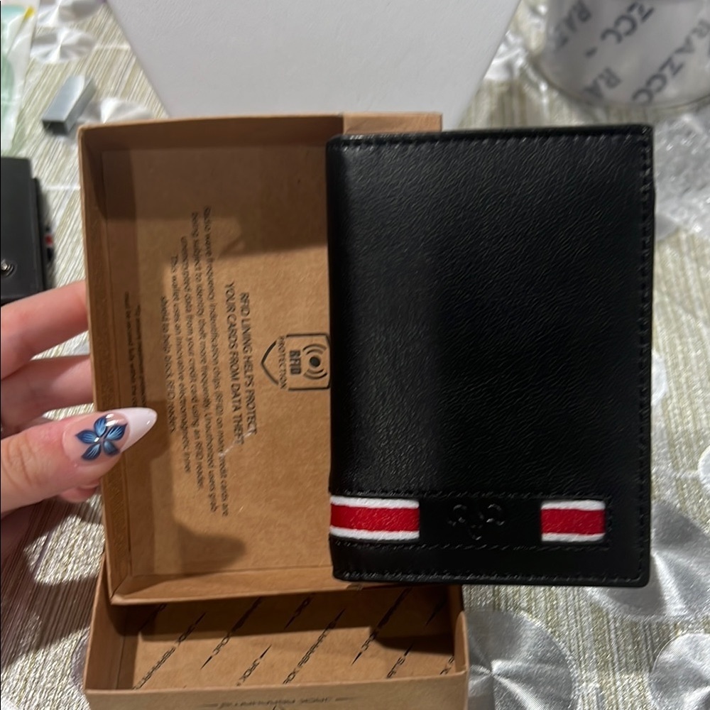 360. Jack Abrahams Black Genuine Leather Wallet with Red and White Accents.